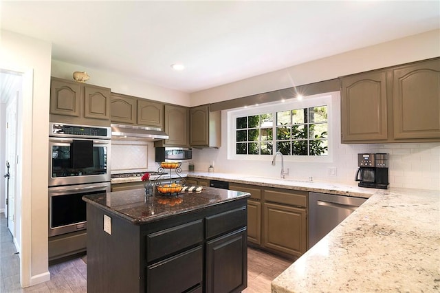 2934 Remy, Burbank, CA 91504 - kitchen with stainless steel appliances, light stone countertops, decorative backsplash, and recessed lighting