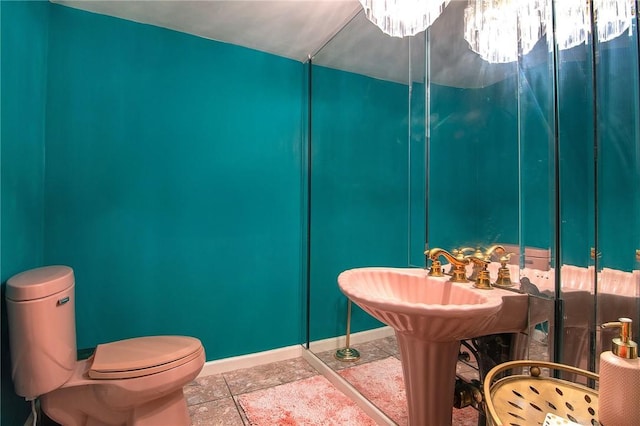 2934 Remy, Burbank, CA 91504 - bathroom featuring toilet, stone finish flooring, and baseboards