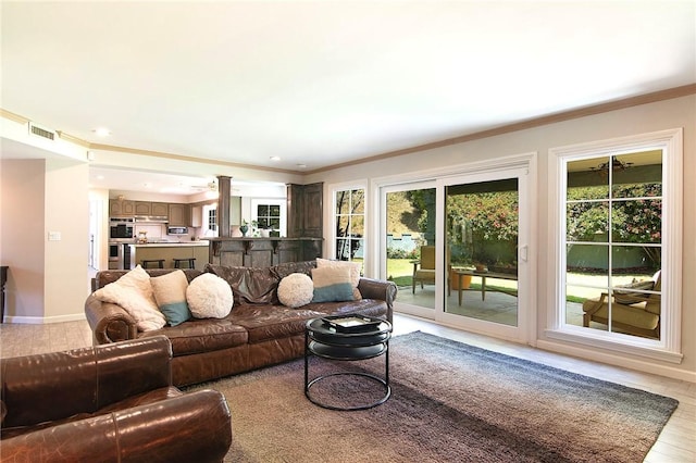 2934 Remy, Burbank, CA 91504 - living area featuring crown molding, healthy amount of natural light, ornate columns, recessed lighting, and light wood-style floors