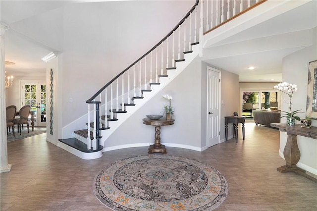 2934 Remy, Burbank, CA 91504 - stairway featuring baseboards, a towering ceiling, a chandelier, wood finished floors, and french doors