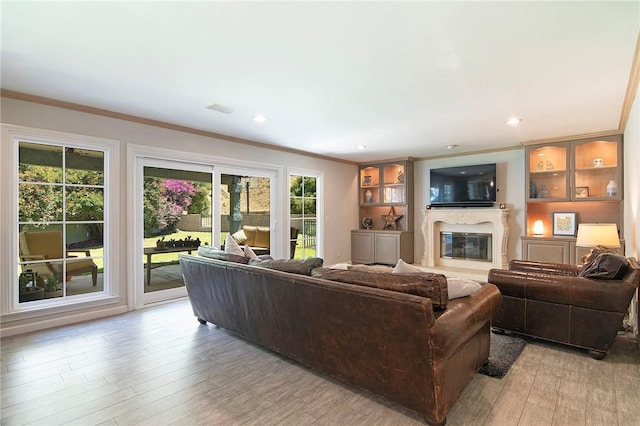 2934 Remy, Burbank, CA 91504 - living room featuring crown molding, a glass covered fireplace, light wood-style floors, and recessed lighting