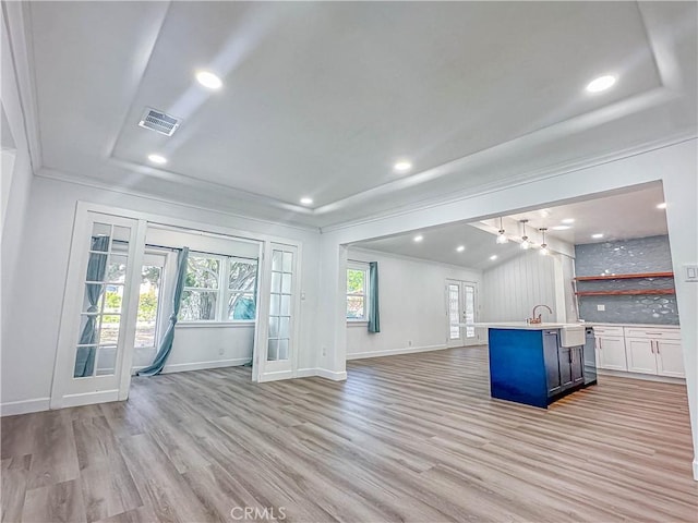 6275 Archibald Ave, Rancho Cucamonga, CA 91737 - unfurnished living room with french doors, ornamental molding, a raised ceiling, light wood finished floors, and baseboards