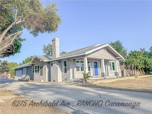 6275 Archibald Ave, Rancho Cucamonga, CA 91737 - single story home with a chimney, driveway, a garage, stucco siding, and a porch