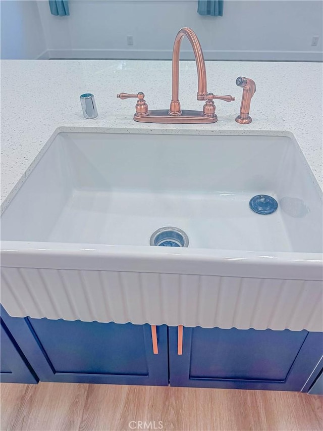 6275 Archibald Ave, Rancho Cucamonga, CA 91737 - bathroom featuring a sink and wood finished floors