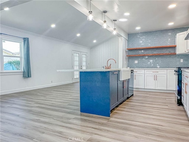 6275 Archibald Ave, Rancho Cucamonga, CA 91737 - kitchen with stainless steel range, white cabinets, dishwasher, backsplash, and crown molding