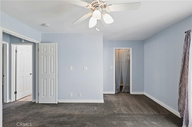 395 Columbia Ave, Merced, CA 95340 - unfurnished bedroom featuring dark colored carpet, baseboards, ceiling fan, and a closet