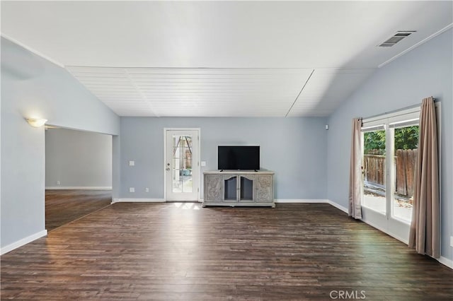 395 Columbia Ave, Merced, CA 95340 - unfurnished living room featuring vaulted ceiling, dark wood-style flooring, and baseboards