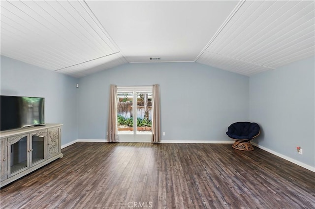 395 Columbia Ave, Merced, CA 95340 - unfurnished living room featuring dark wood finished floors, vaulted ceiling, and baseboards