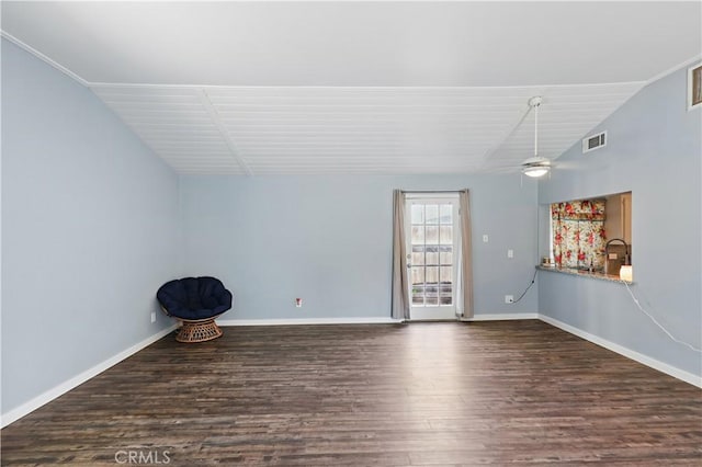 395 Columbia Ave, Merced, CA 95340 - unfurnished living room with lofted ceiling, wood finished floors, baseboards, and a ceiling fan