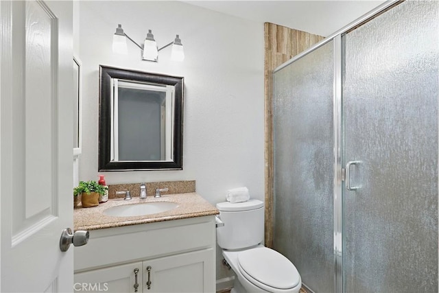 395 Columbia Ave, Merced, CA 95340 - bathroom with vanity, a stall shower, and toilet
