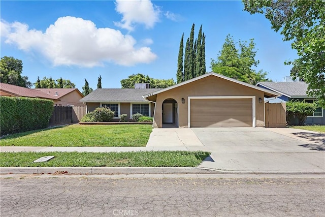395 Columbia Ave, Merced, CA 95340 - ranch-style home with an attached garage, concrete driveway, and stucco siding
