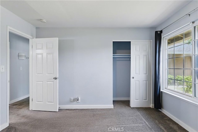 395 Columbia Ave, Merced, CA 95340 - unfurnished bedroom with carpet, multiple windows, and baseboards