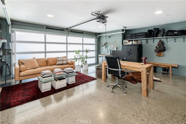 68 E F St, Encinitas, CA 92024 - office space featuring speckle patterned floor, concrete block wall, a garage, and recessed lighting