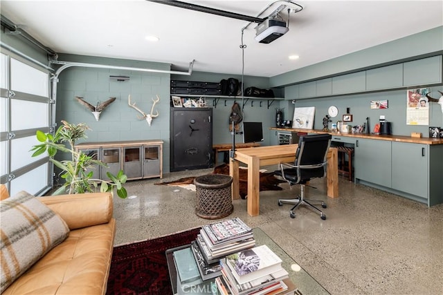 68 E F St, Encinitas, CA 92024 - office space featuring speckle patterned floor, concrete block wall, recessed lighting, and a garage