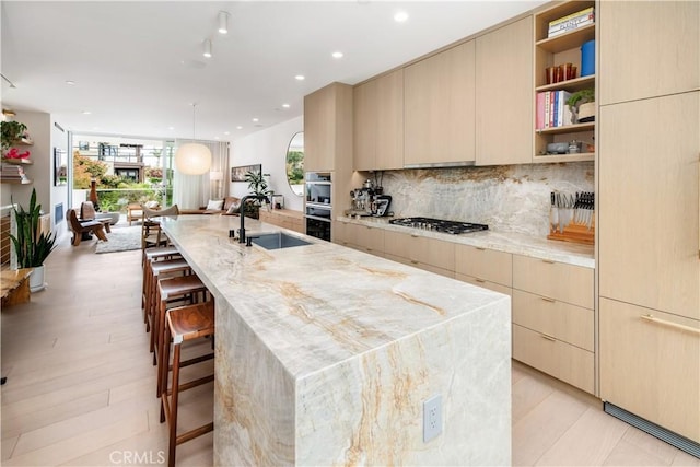 68 E F St, Encinitas, CA 92024 - kitchen with modern cabinets, a sink, a center island with sink, appliances with stainless steel finishes, and recessed lighting