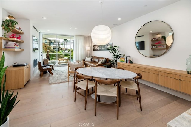 68 E F St, Encinitas, CA 92024 - dining area featuring a wall of windows, recessed lighting, and light wood finished floors