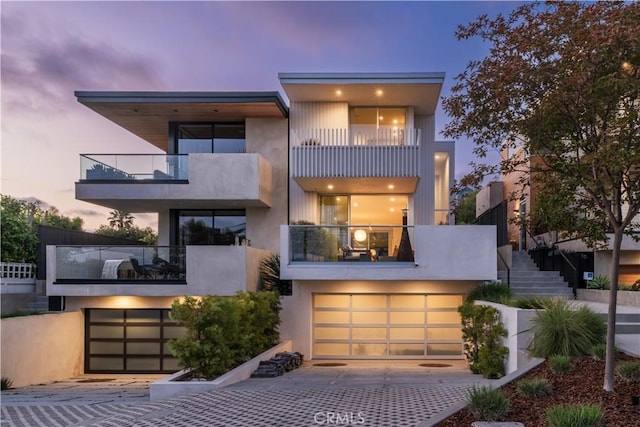 68 E F St, Encinitas, CA 92024 - contemporary house with a balcony, driveway, an attached garage, and stairs