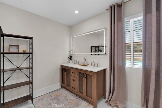 254 Piedmont Ave, Claremont, CA 91711 - full bath with baseboards, double vanity, and recessed lighting