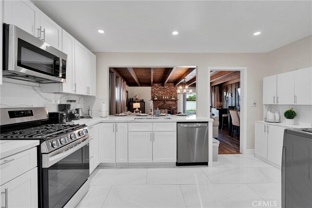 254 Piedmont Ave, Claremont, CA 91711 - kitchen featuring appliances with stainless steel finishes, a sink, light countertops, white cabinets, and recessed lighting