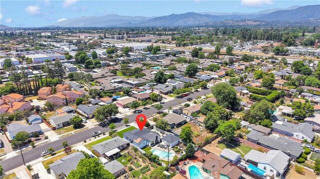 254 Piedmont Ave, Claremont, CA 91711 - aerial view of property and surrounding area with a mountainous background, a pool, and nearby suburban area