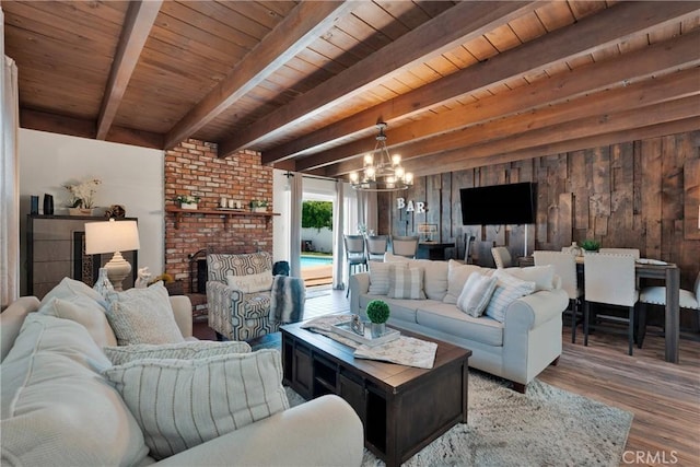 254 Piedmont Ave, Claremont, CA 91711 - living room featuring wood finished floors, a chandelier, wood ceiling with exposed beams, and wooden walls