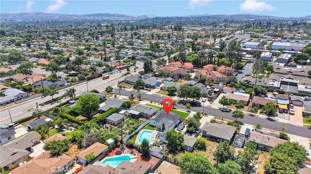 254 Piedmont Ave, Claremont, CA 91711 - aerial overview of property's location with nearby suburban area, a pool, and a mountainous background