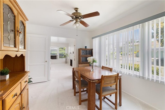 7933 Rhea Vista Dr, Whittier, CA 90602 - dining room with light colored carpet and a ceiling fan