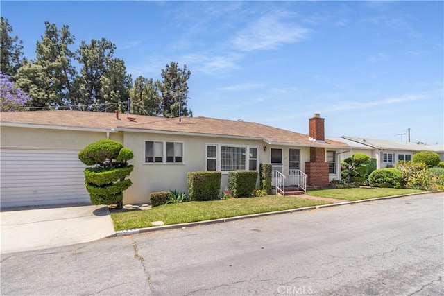 7933 Rhea Vista Dr, Whittier, CA 90602 - ranch-style house with a chimney, driveway, stucco siding, a garage, and a front yard