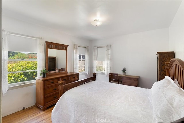 7933 Rhea Vista Dr, Whittier, CA 90602 - bedroom with light wood finished floors and baseboards