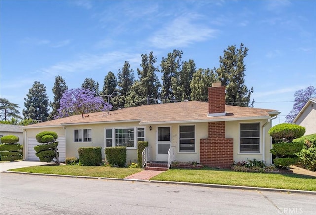 7933 Rhea Vista Dr, Whittier, CA 90602 - ranch-style house with a chimney, a front yard, concrete driveway, and stucco siding