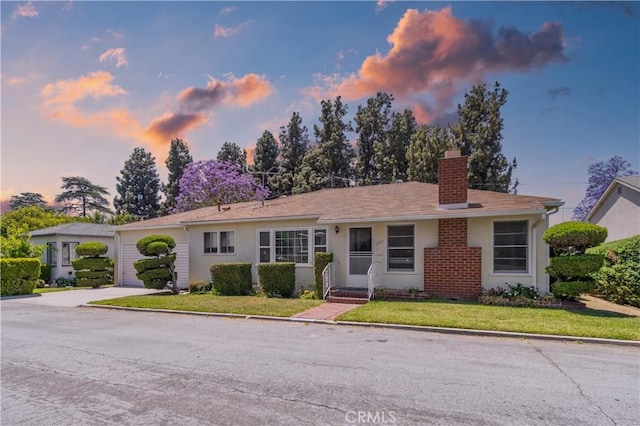 7933 Rhea Vista Dr, Whittier, CA 90602 - single story home with a chimney, concrete driveway, a yard, and stucco siding