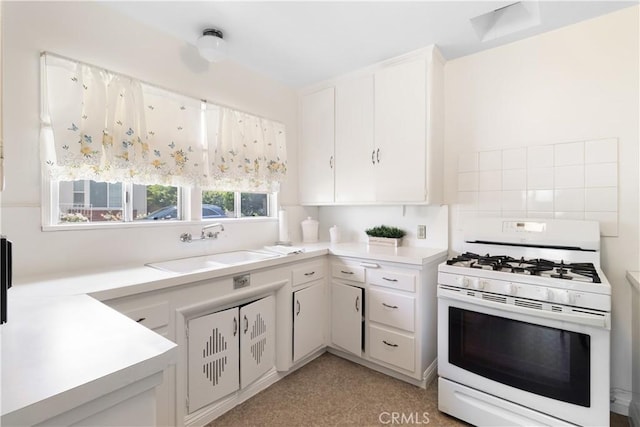 7933 Rhea Vista Dr, Whittier, CA 90602 - kitchen with white gas range, a sink, light countertops, and white cabinetry
