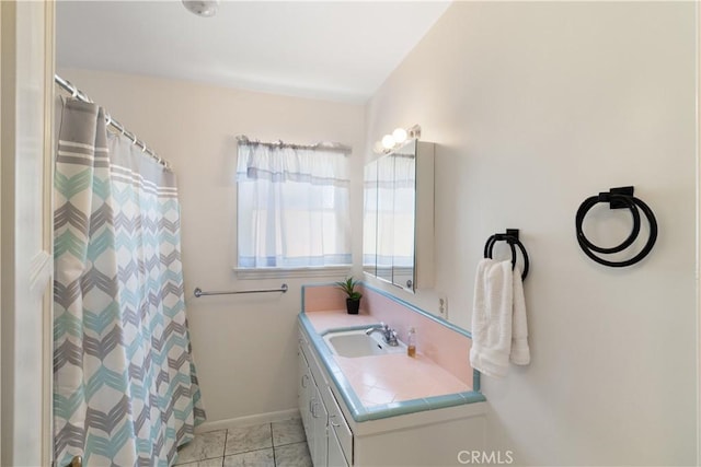 7933 Rhea Vista Dr, Whittier, CA 90602 - bathroom with vanity, baseboards, and curtained shower