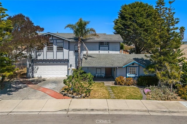 639 S 7th St, Grover Beach, CA 93433 - traditional-style house featuring an attached garage, driveway, a porch, and a shingled roof