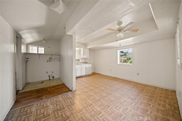639 S 7th St, Grover Beach, CA 93433 - unfurnished living room featuring a ceiling fan, healthy amount of natural light, and vaulted ceiling