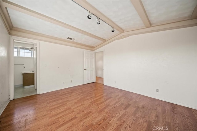 639 S 7th St, Grover Beach, CA 93433 - empty room with rail lighting, light wood-style floors, and baseboards
