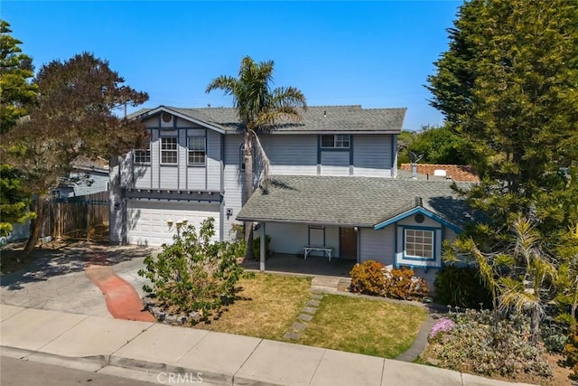 639 S 7th St, Grover Beach, CA 93433 - traditional-style house with covered porch, an attached garage, a shingled roof, and concrete driveway
