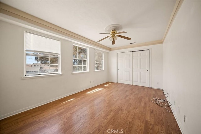639 S 7th St, Grover Beach, CA 93433 - unfurnished bedroom with wood finished floors, a closet, baseboards, ornamental molding, and a ceiling fan