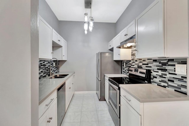 8328 Regents Rd Unit 1D, San Diego, CA 92122 - kitchen featuring a sink, appliances with stainless steel finishes, under cabinet range hood, backsplash, and light countertops