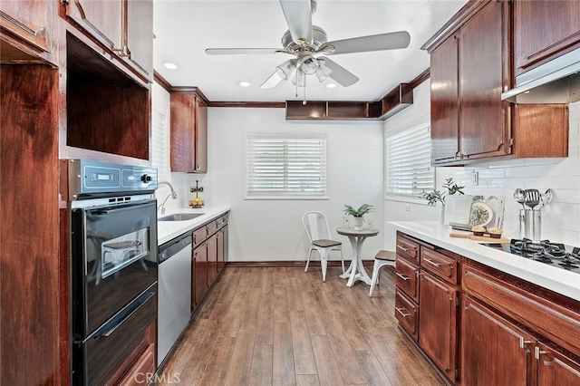 16432 Mcrae Ave, Norwalk, CA 90650 - kitchen featuring dishwasher, ceiling fan, light countertops, tasteful backsplash, and under cabinet range hood