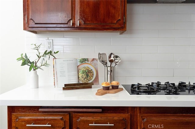 16432 Mcrae Ave, Norwalk, CA 90650 - kitchen view of black gas stovetop, tasteful backsplash, and light countertops