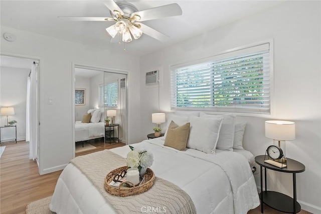 16432 Mcrae Ave, Norwalk, CA 90650 - bedroom featuring a closet, light wood-style flooring, baseboards, a ceiling fan, and a wall mounted air conditioner