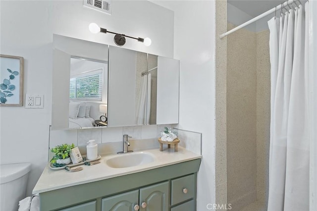 16432 Mcrae Ave, Norwalk, CA 90650 - full bathroom featuring vanity, curtained shower, toilet, and ensuite bathroom