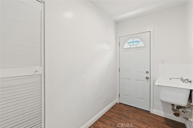 16432 Mcrae Ave, Norwalk, CA 90650 - entrance foyer featuring dark wood-type flooring and baseboards
