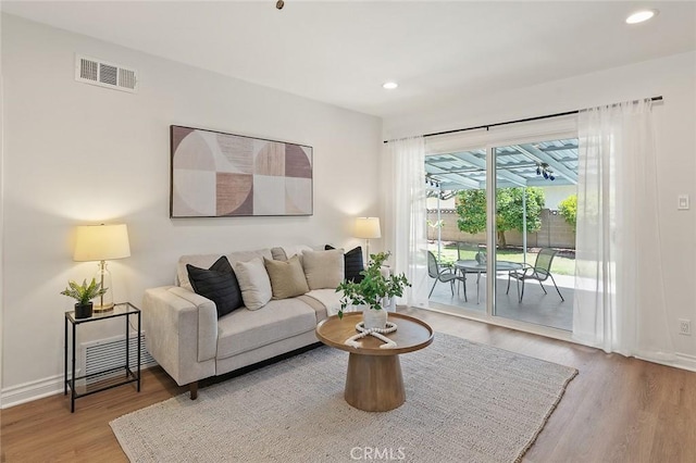 16432 Mcrae Ave, Norwalk, CA 90650 - living room featuring wood finished floors, recessed lighting, and baseboards