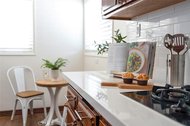 16432 Mcrae Ave, Norwalk, CA 90650 - kitchen with black stovetop, wood finished floors, and light countertops