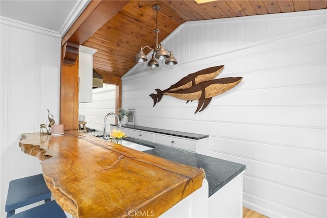 41 19th St, Cayucos, CA 93430 - kitchen with a sink, wood ceiling, a peninsula, vaulted ceiling, and hanging light fixtures