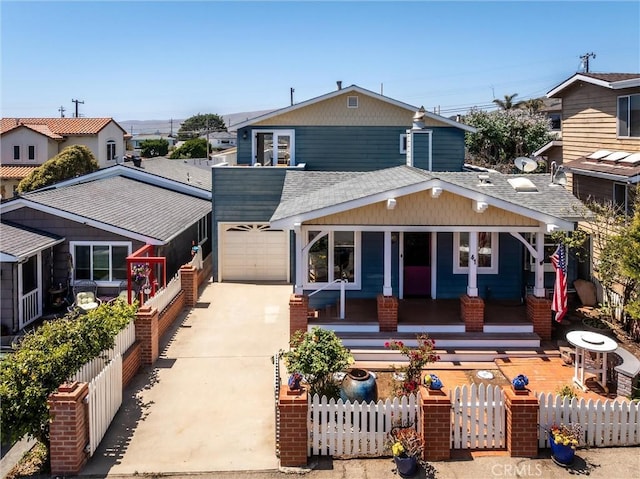 41 19th St, Cayucos, CA 93430 - view of front facade with concrete driveway, covered porch, a fenced front yard, and an attached garage