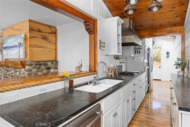 41 19th St, Cayucos, CA 93430 - kitchen with a sink, range hood, wood ceiling, light wood-type flooring, and white cabinetry