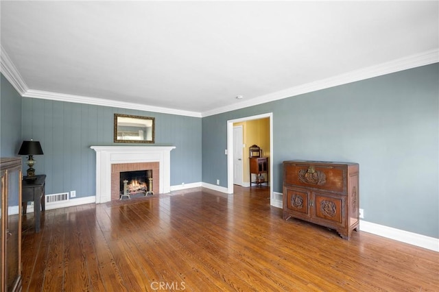 13617 Bassett St, Valley Glen, CA 91405 - living room with crown molding, wood finished floors, and a brick fireplace